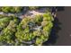 Stunning aerial shot showcasing the lakefront property surrounded by mature trees and a convenient boat dock at 373 & 375 Sagamore Dr, Louisburg, NC 27549