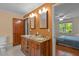 Bathroom features double sinks with granite countertops and a separate view into an adjacent bedroom at 373 & 375 Sagamore Dr, Louisburg, NC 27549