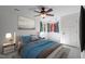 Comfortable bedroom with a ceiling fan, large windows, and neutral decor at 373 & 375 Sagamore Dr, Louisburg, NC 27549