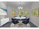Elegant dining room with marble-topped table and chandelier lighting at 373 & 375 Sagamore Dr, Louisburg, NC 27549
