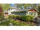 Side exterior of home with well-maintained garden beds and a glimpse of the attached garage at 373 & 375 Sagamore Dr, Louisburg, NC 27549