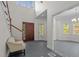 Grand foyer with soaring ceilings, hardwood floors, and elegant staircase at 373 & 375 Sagamore Dr, Louisburg, NC 27549