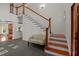 Spacious foyer with hardwood staircase, chandelier, and elegant decor at 373 & 375 Sagamore Dr, Louisburg, NC 27549
