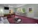 Entertainment-ready game room featuring a billiard table, comfortable seating, and great natural light at 373 & 375 Sagamore Dr, Louisburg, NC 27549