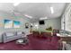 Fun game room featuring a billiard table, comfortable seating, bar top and natural light at 373 & 375 Sagamore Dr, Louisburg, NC 27549