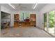 Spacious garage with built-in shelving and work area, perfect for storage and projects at 373 & 375 Sagamore Dr, Louisburg, NC 27549