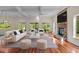Bright living room featuring hardwood floors, fireplace, and patio access at 373 & 375 Sagamore Dr, Louisburg, NC 27549