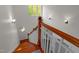 Hardwood staircase with white banister, highlighted by a charming round stained glass window at 373 & 375 Sagamore Dr, Louisburg, NC 27549