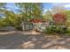 Spacious three-car garage featuring a well-maintained concrete driveway at 373 Sagamore Dr, Louisburg, NC 27549
