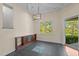 Bright office with tile floors, built-in shelves, natural light, and views of the landscaped backyard at 373 Sagamore Dr, Louisburg, NC 27549