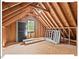 Large unfinished attic providing ample potential for renovation, showcasing open framing at 4 N Poston Ct, Durham, NC 27705