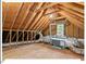 Unfinished attic space with exposed rafters, duct work and natural light at 4 N Poston Ct, Durham, NC 27705