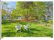 Relaxing backyard featuring Adirondack chairs and lush landscaping, perfect for outdoor enjoyment at 4 N Poston Ct, Durham, NC 27705