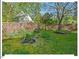 Tranquil backyard featuring pond with rock border and lush greenery, a nature lover's retreat at 4 N Poston Ct, Durham, NC 27705