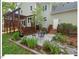 Spacious backyard with outdoor patio area and lush landscaping, perfect for entertaining at 4 N Poston Ct, Durham, NC 27705