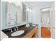 Bathroom featuring a dual vanity and bright natural light from an exterior window at 4 N Poston Ct, Durham, NC 27705