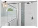 Beautiful glass shower with mosaic tile accent and rainfall showerhead at 4 N Poston Ct, Durham, NC 27705