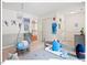 Cozy bedroom features a swing chair and playful Carolina-themed decorations at 4 N Poston Ct, Durham, NC 27705
