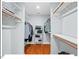 Walk-in closet with ample shelving and storage space for clothes and accessories at 4 N Poston Ct, Durham, NC 27705
