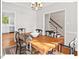 Comfortable dining room featuring a wooden table, six chairs, and hardwood floors at 4 N Poston Ct, Durham, NC 27705