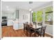 Dining room with many windows and a view into the kitchen at 4 N Poston Ct, Durham, NC 27705