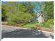 Charming home with a well-maintained front yard and lush landscaping from a street view at 4 N Poston Ct, Durham, NC 27705