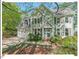 Charming two-story home with a well-manicured lawn and inviting front porch at 4 N Poston Ct, Durham, NC 27705