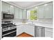 Stylish kitchen showcases stainless steel appliances and ample counter space at 4 N Poston Ct, Durham, NC 27705