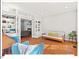 Inviting living room with hardwood floors, built-in shelves, and a comfortable futon at 4 N Poston Ct, Durham, NC 27705
