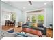 Inviting living room flows to a dining area, with hardwood floors and natural light at 4 N Poston Ct, Durham, NC 27705