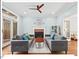 Stylish living room with modern furniture, a fireplace, and access to outdoor patio at 4 N Poston Ct, Durham, NC 27705