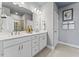 Modern bathroom featuring a double sink vanity with stylish fixtures and a large mirror at 404 Gaston Park Ln # 100, Wake Forest, NC 27587