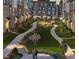 Scenic courtyard with walkways, manicured lawns, and lush landscaping for residents to enjoy at 404 Gaston Park Ln # 100, Wake Forest, NC 27587