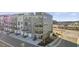 Modern three-story townhome featuring private balconies, sleek design, and convenient street parking at 404 Gaston Park Ln # 100, Wake Forest, NC 27587