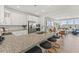 Open kitchen showcasing granite counters, stainless appliances, and spacious island with breakfast bar at 404 Gaston Park Ln # 100, Wake Forest, NC 27587