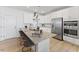 Modern kitchen features granite countertops, stainless steel appliances, and a large island with seating at 404 Gaston Park Ln # 100, Wake Forest, NC 27587