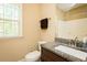 Cozy bathroom features a granite-topped vanity and tub with shower at 4057 Mackenzie Dr, Haw River, NC 27258