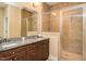 Bathroom with double granite vanity, and glass enclosed tile shower at 4057 Mackenzie Dr, Haw River, NC 27258