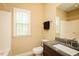 Bright bathroom with granite vanity, tile shower, and natural light at 4057 Mackenzie Dr, Haw River, NC 27258