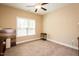 Bright bedroom with neutral walls, carpeted floor, and a large window at 4057 Mackenzie Dr, Haw River, NC 27258