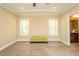 Spacious carpeted bedroom with recessed lighting, windows, and bath access at 4057 Mackenzie Dr, Haw River, NC 27258