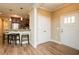Welcoming entrance with plank flooring, front door, and view of the kitchen at 4057 Mackenzie Dr, Haw River, NC 27258