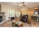 Inviting living room with hardwood floors, fireplace, and neutral tones at 4057 Mackenzie Dr, Haw River, NC 27258