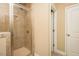 Shower with tile surround and glass door at 4057 Mackenzie Dr, Haw River, NC 27258