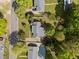 Aerial view of a house with lush, mature trees and greenery at 410 Long Ave, Roxboro, NC 27573