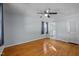 A well-lit bedroom features hardwood floors and an attached bathroom at 410 Long Ave, Roxboro, NC 27573