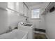 A laundry room features a sink and washer at 410 Long Ave, Roxboro, NC 27573