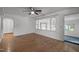 A cozy living room boasts hardwood floors and natural light at 410 Long Ave, Roxboro, NC 27573
