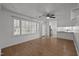 Expansive living room area featuring hardwood floors, natural light, and an open layout at 410 Long Ave, Roxboro, NC 27573
