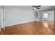 A cozy living room boasts hardwood floors and a built-in shelf at 410 Long Ave, Roxboro, NC 27573